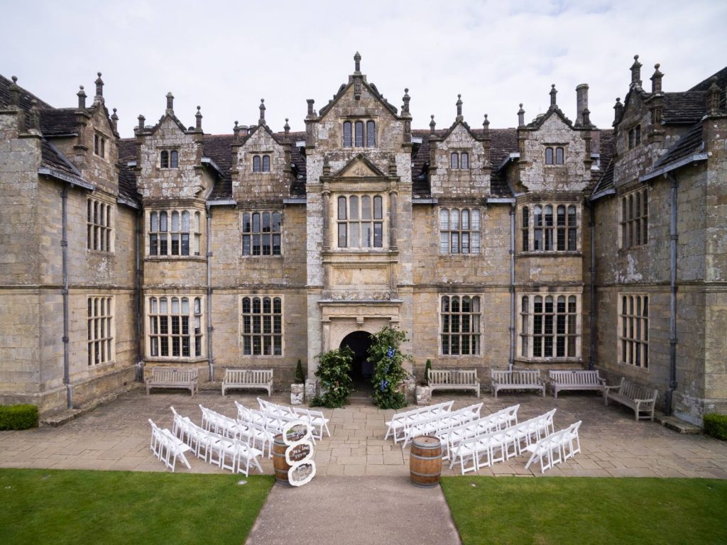 The front of Wakehurst Place set up for a wedding.