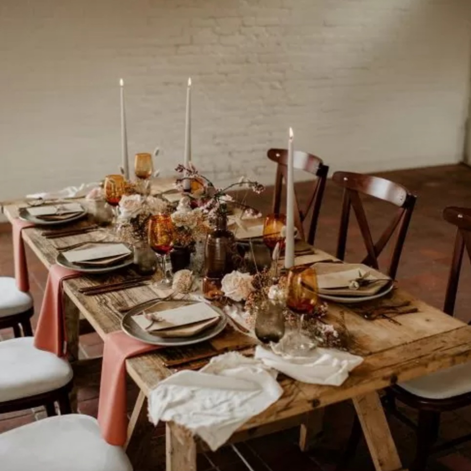 A rustic table set for Halloween dinner.