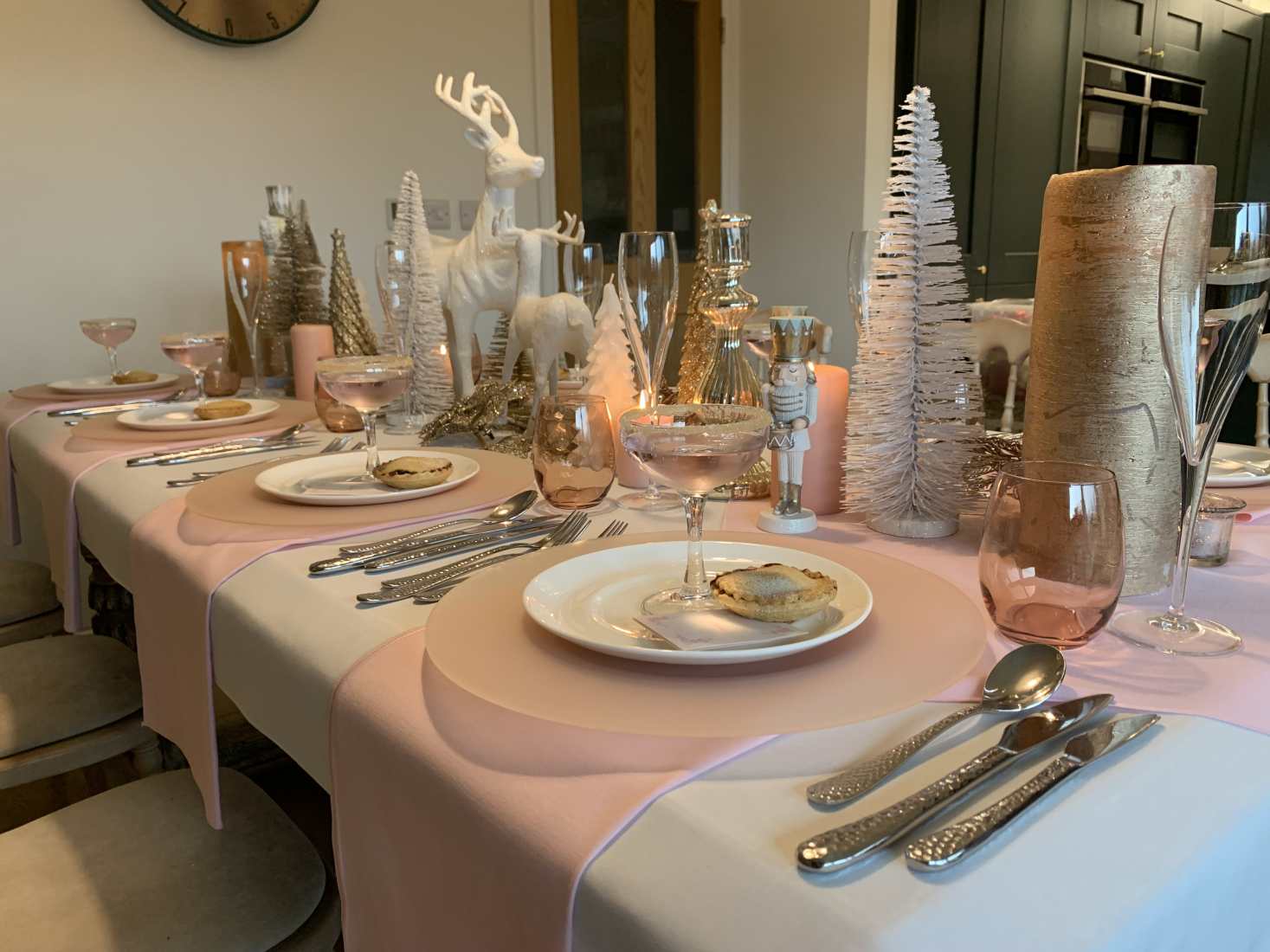 A Sugar Plum Christmas table setting in white and pink.