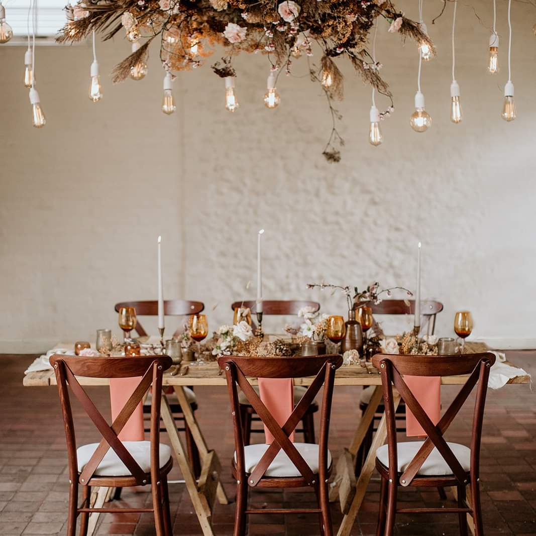 A peaches and cream themed rusic wedding table for 6.