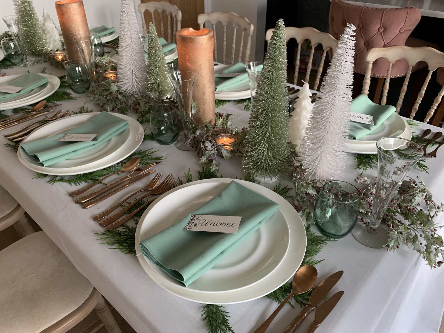 A celadon Christmas table setting in white, green and cream.