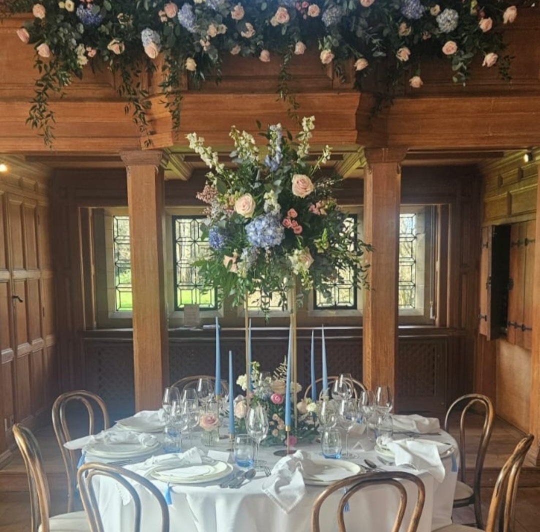 A spring themes table with a large pastel coloured table centrepiece and canape.