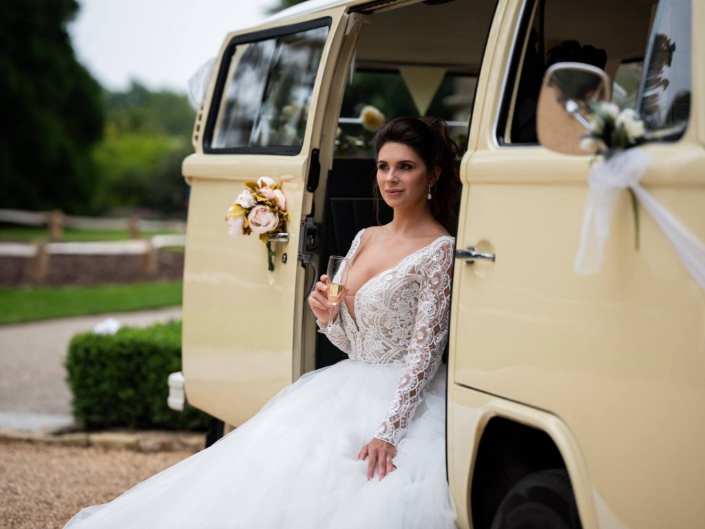 A bride sitting on a VW campervan