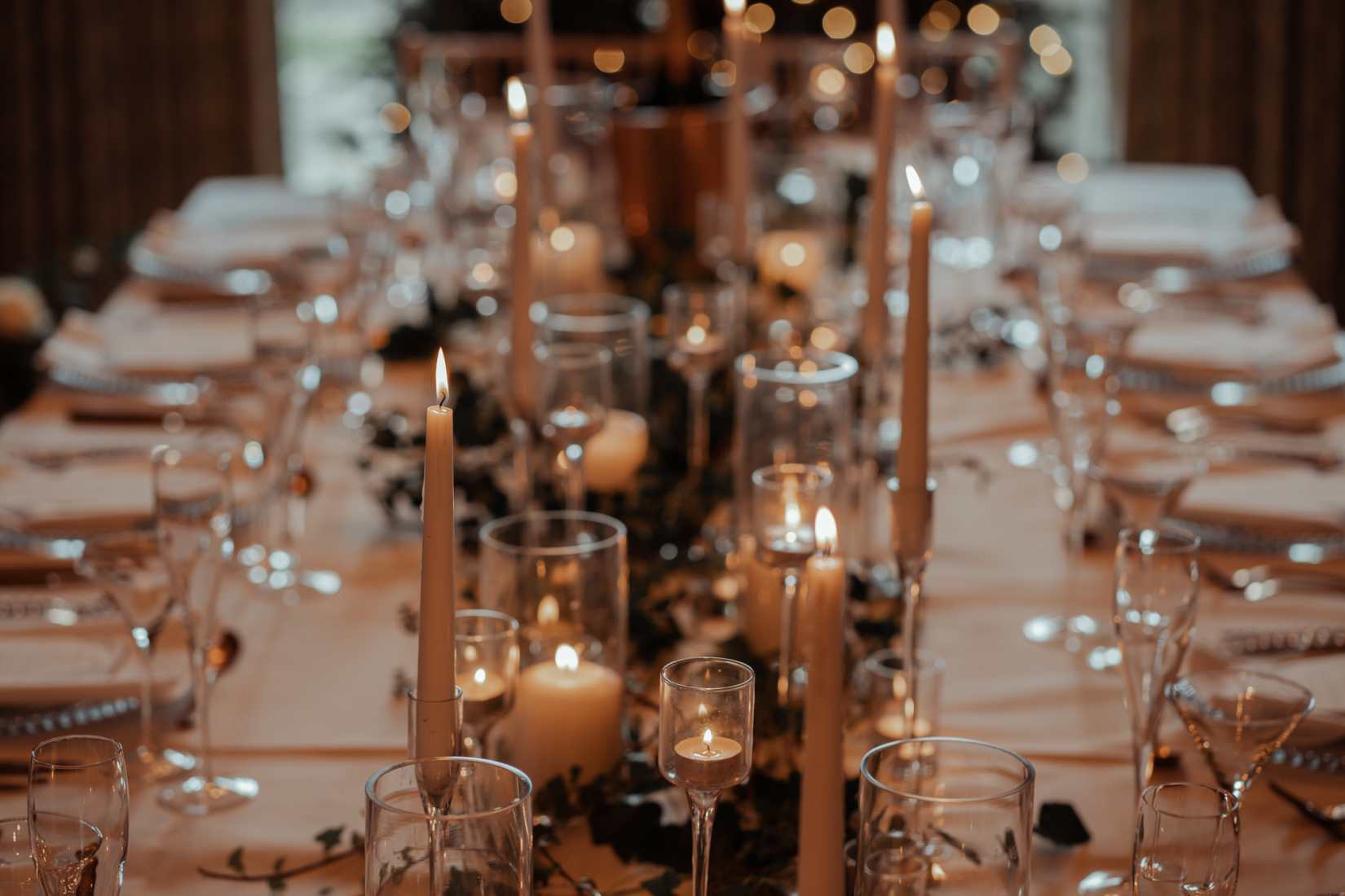 Fully laid table of winter wedding hire items.