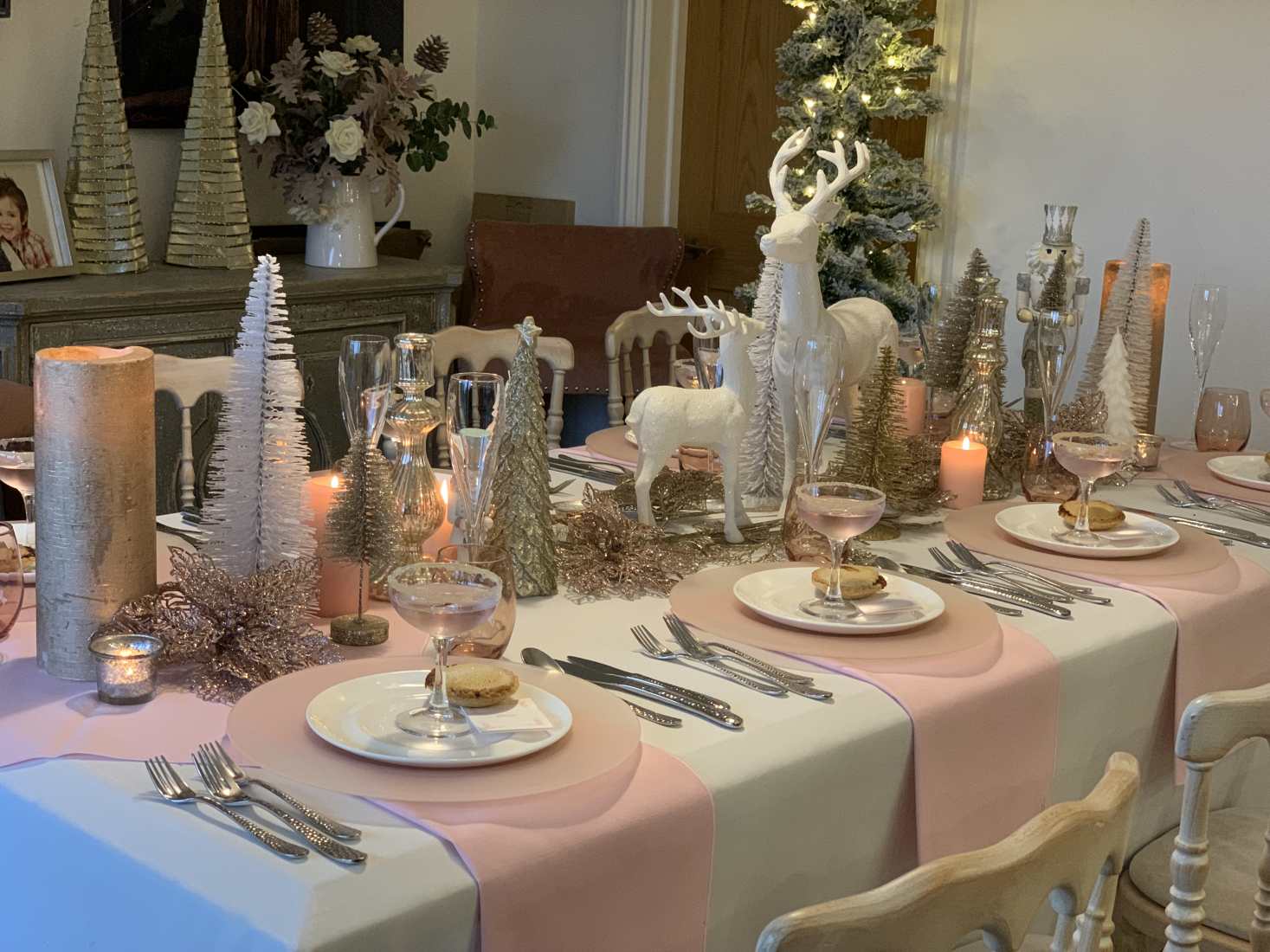 A Sugar Plum Christmas table setting in pink and white.